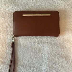 Steve Madden branded clutch- zipper with handle.